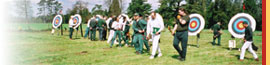 Image of archers walking back from target faces on the WCofA archery field